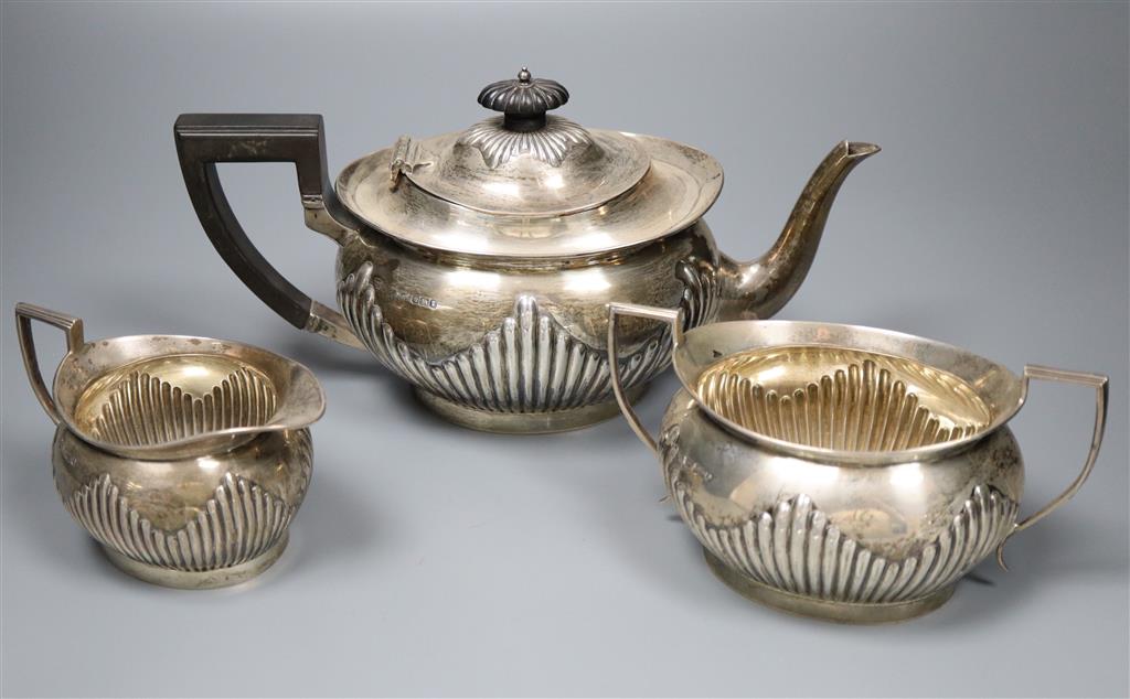 An Edwardian silver three piece tea set by Mappin & Webb, Sheffield, 1900, 1908/9,